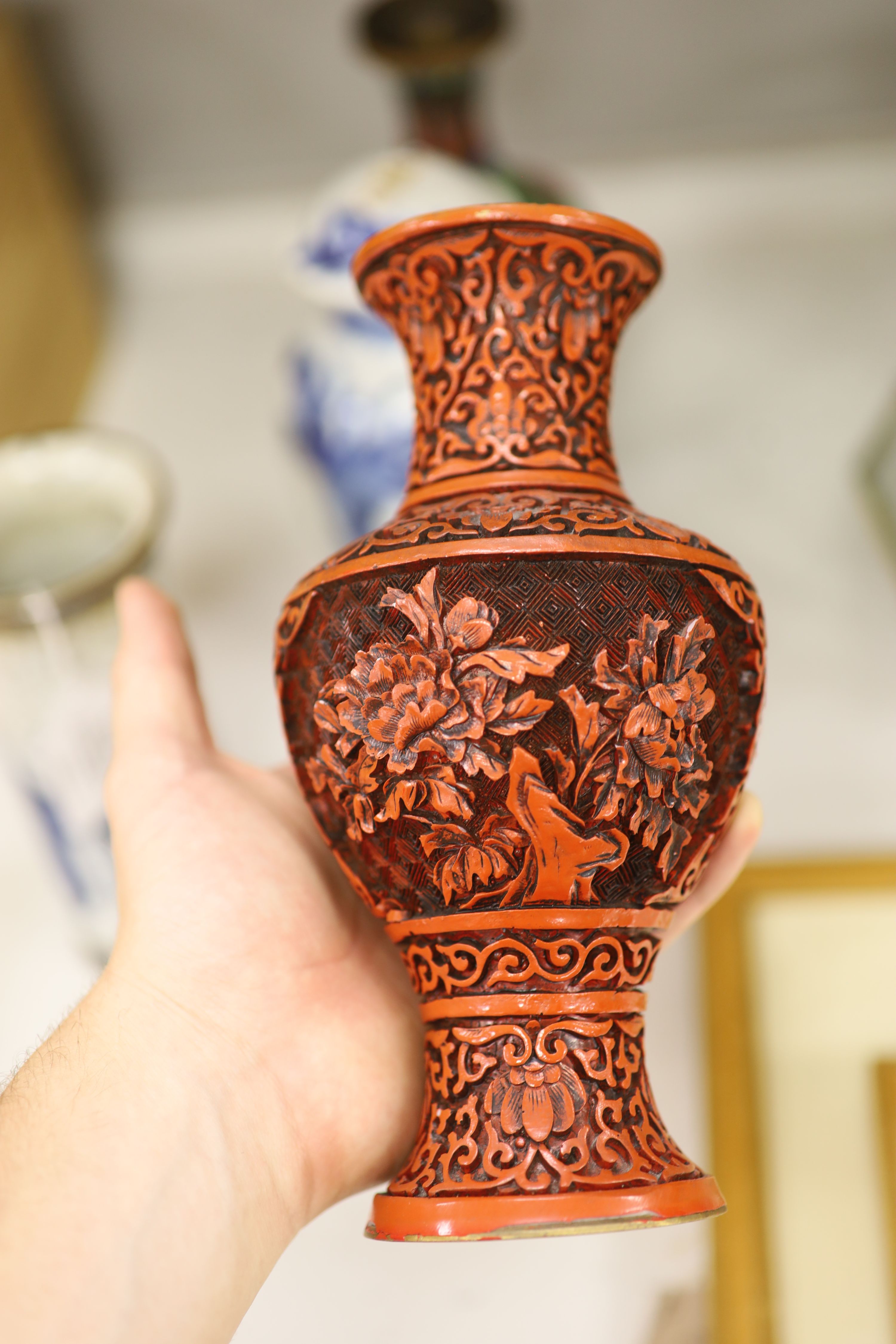 Three Chinese blue and white vases, a cloisonne enamel vase, another vase and a soapstone figure